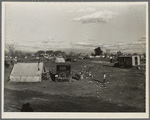 Hooverville of Bakersfield, California. A rapidly growing community of people living rent-free on the edge of the town dump in whatever kind of shelter available. Approximately one thousand people now living here and raising children