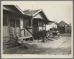 Mexican quarter of Los Angeles, California. Average rental is eight dollars. Some houses have plumbing