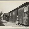 Mexican quarter of Los Angeles. One quarter mile from City Hall. Area has been condemned and will be torn down shortly to make space for the new Union Railroad station. Average rent is eight dollars