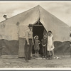 Migrant family in Kern County. This family was sent back at the state line by the Los Angeles police. Refused entrance into California, and it was only after they had gone back to Arkansas to borrow fifty dollars ... that they were permitted to enter