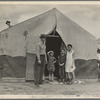 Migrant family in Kern County. This family was sent back at the state line by the Los Angeles police. Refused entrance into California, and it was only after they had gone back to Arkansas to borrow fifty dollars ... that they were permitted to enter