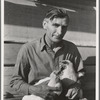 Rural rehabilitation client. Chicken farmer making good on rural resettlement loan. He sells one case of eggs a day. Worked on a state emergency relief administration job previous to loan. San Fernando Valley, California