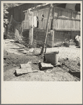 Home of Mexican field worker showing water supply. Brawley, Imperial Valley, California