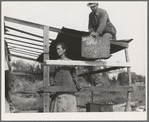 Dispossessed Arkansas farmers. These people are resettling themselves on the dump outside of Bakersfield, California