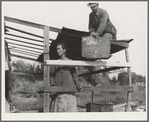 Dispossessed Arkansas farmers. These people are resettling themselves on the dump outside of Bakersfield, California