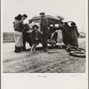 Migrants, family of Mexicans, on road with tire trouble. Looking for work in the peas. California