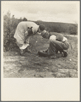 Migrant pea workers on the road with tire trouble. California