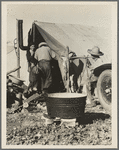 Migrant camp [California?]. Tent with wash tub in foreground