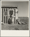 Resettled at Bosque Farms project. Family of four from Taos Junction shows temporary dwelling