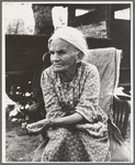 Mother of family camped near a creek bed, panning for gold. "Slept in a bed all my life long till now--sleeping on the ground." Near Redding, California