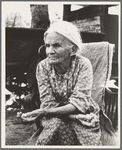 Mother of family camped near a creek bed, panning for gold. "Slept in a bed all my life long till now--sleeping on the ground." Near Redding, California