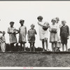 Sharecroppers' families gathering needs for their 4th of July celebration, whites and blacks together. Hill House, Mississippi