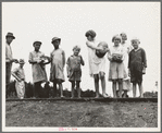 Sharecroppers' families gathering needs for their 4th of July celebration, whites and blacks together. Hill House, Mississippi