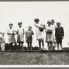 Sharecroppers' families gathering needs for their 4th of July celebration, whites and blacks together. Hill House, Mississippi