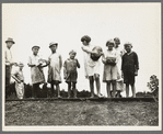 Sharecroppers' families gathering needs for their 4th of July celebration, whites and blacks together. Hill House, Mississippi