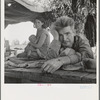 Drought refugees from Oklahoma camping by the roadside. They hope to work in the cotton fields. There are seven in family. Blythe, California