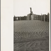 A corral practically buried by drifted dust. Mills, New Mexico. Therefore, the fertile top soil of a grazing area cannot be utilized