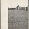 A corral practically buried by drifted dust. Mills, New Mexico. Therefore, the fertile top soil of a grazing area cannot be utilized