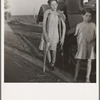 Children of Oklahoma drought refugees on highway near Bakersfield, California. Family of six; no shelter, no food, no money and almost no gasoline. The child has bone tuberculosis