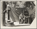 Jack Neill, "migratory fruit tramp," on banks of Pulah Creek near Winters, California. He owns one acre subsistence farm near Porterville ...