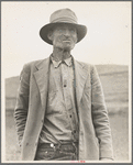 This man is a labor contractor in the pea fields of California. "One-Eye" Charlie gives his views. "I'm making my living off of these people (migrant laborers) so I know the conditions." San Luis Obispo County, California