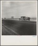 Migrant family on U.S. Highway 99 between Bakersfield and Famoso, California. Note: the photographer passed twenty-eight cars of this type while driving thirty-five miles between 9:00 and 9:45 in the morning