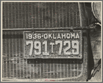 Radiator and license of Oklahoma cotton picker's car. San Joaquin Valley, near Fresno, California