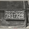 Radiator and license of Oklahoma cotton picker's car. San Joaquin Valley, near Fresno, California