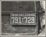 Radiator and license of Oklahoma cotton picker's car. San Joaquin Valley, near Fresno, California