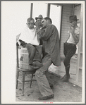 Community barber shop in Kern County migrant camp, California
