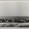 Company housing for Mexican cotton pickers, showing the San Joaquin Valley in the background. South of Corcoran, California