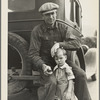 1936 drought refugee from Polk, Missouri. Awaiting the opening of orange picking season at Porterville, California