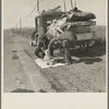Missouri family of five, seven months from the drought area, on U.S. Highway 99 near Tracy, California