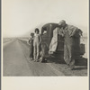 Oklahoma sharecropper and family entering California. Stalled on the desert near Indio, California