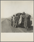 Oklahoma sharecropper and family entering California. Stalled on the desert near Indio, California