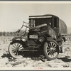 Texan refugees' car. They are seeking work in the carrot fields of the Coachella Valley. California