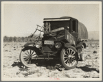 Texan refugees' car. They are seeking work in the carrot fields of the Coachella Valley. California