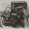 Texan refugees' car. They are seeking work in the carrot fields of the Coachella Valley. California