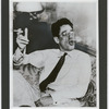 George S. Kaufman smoking, blowing smoke