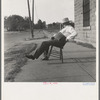 The sheriff of McAlester, Oklahoma, sitting in front of the jail. He has been sheriff for thirty years