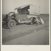Family between Dallas and Austin, Texas. The people have left their home and connections in South Texas, and hope to reach the Arkansas Delta for work in the cotton fields. Penniless people. No food and three gallons of gas in the tank ...