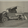 Family between Dallas and Austin, Texas. The people have left their home and connections in South Texas, and hope to reach the Arkansas Delta for work in the cotton fields. Penniless people. No food and three gallons of gas in the tank ...