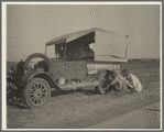 Family between Dallas and Austin, Texas. The people have left their home and connections in South Texas, and hope to reach the Arkansas Delta for work in the cotton fields. Penniless people. No food and three gallons of gas in the tank ...