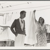 Tom Collins, manager of Kern migrant camp, talking with one of the members. California