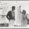 Tom Collins, manager of Kern migrant camp, talking with one of the members. California