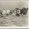 Wife and five children of migratory fruit worker. American River camp on outskirts of Sacramento, California. Have worked in the fruit since 1931. "We don't make a living, but we live on what we make"