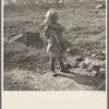 Daughter of a migrant fruit worker. American River camp outside of Sacramento, California