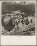 Drought refugees from Chickasaw, Oklahoma. Three families traveling together. They can't travel because of lack of money for trailer license. Near Santa Maria, California