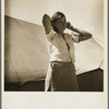Woman in pea picker's camp. California. "I seen our corn dry up and blow over the fence back there in Oklahoma."
