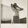 Woman in pea picker's camp. California. "I seen our corn dry up and blow over the fence back there in Oklahoma."